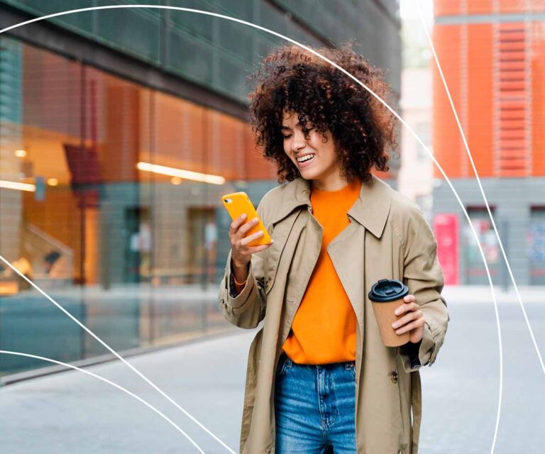 News Posting Graphic with a photo of a young woman in the street,holding a mobile phone in one hand and a coffee to go in the other hand and smiling -Payment solutions